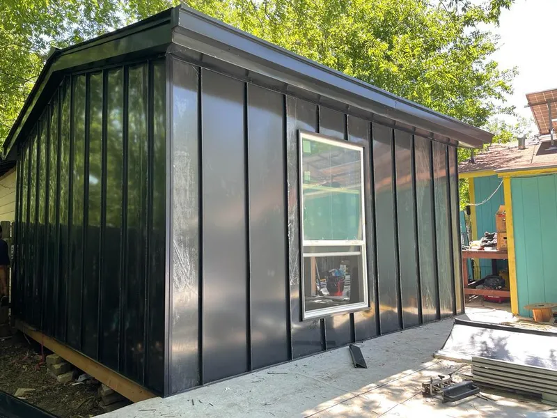 Black standing seam metal wall panels for Roof Inspection in Delta